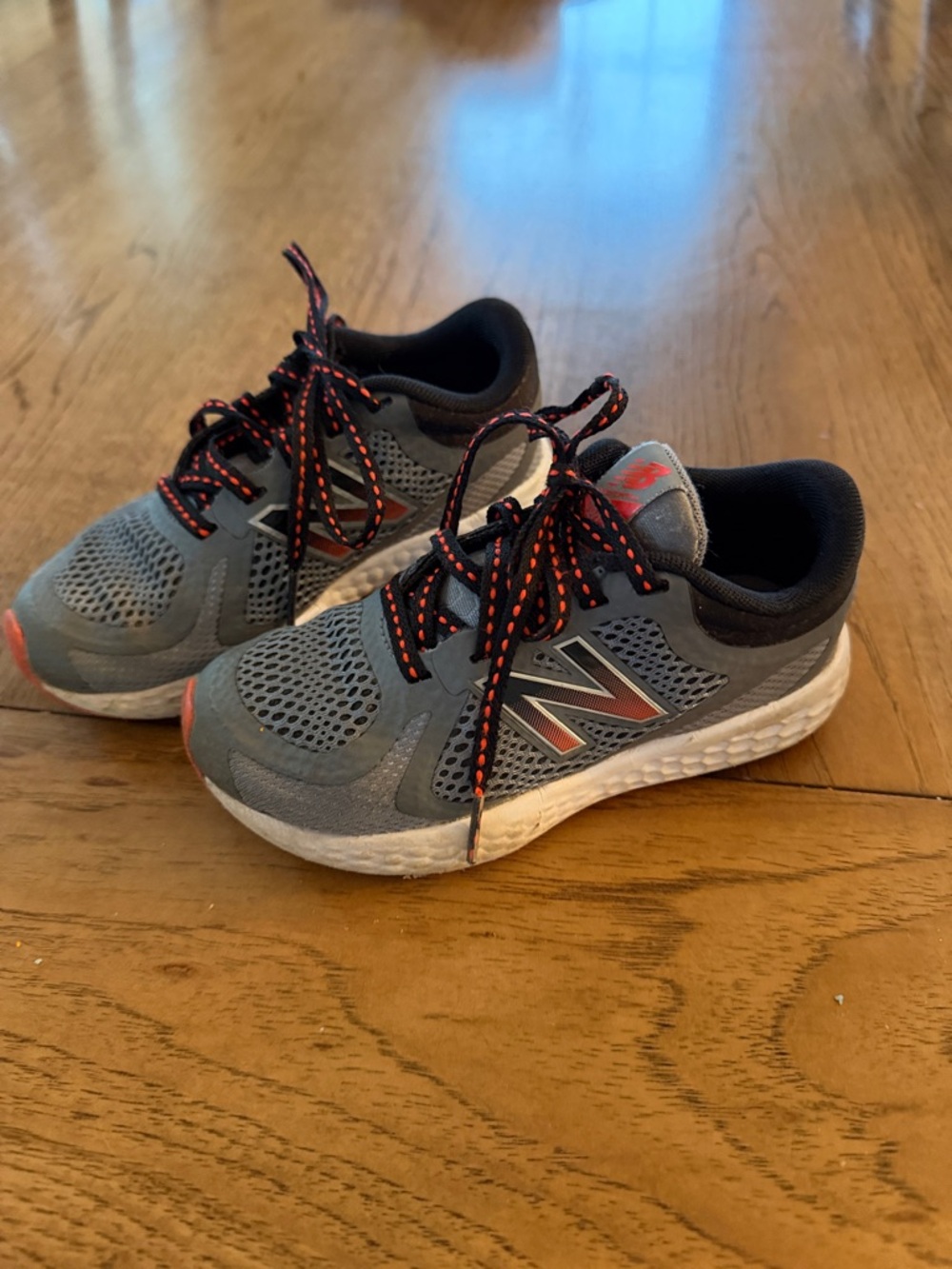 New Balance Kids 10.5 sneakers Gray Sneakers with Orange Accents